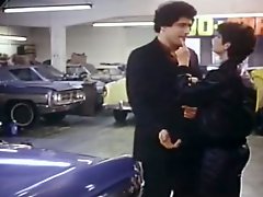 Raunchy brunette gal gives blowjob to car dealer at his workplace